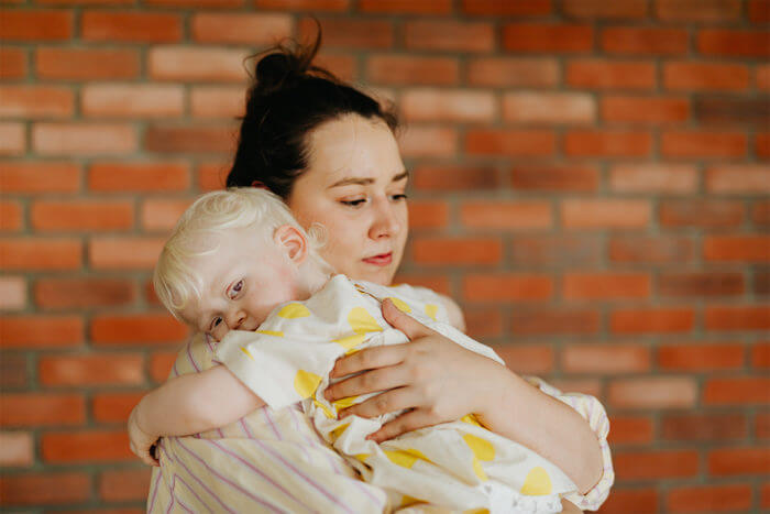 Photo of a mother holding a baby