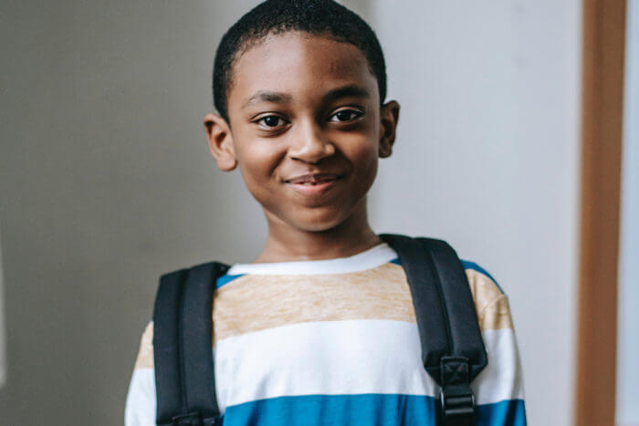 Photo of a Black child with backpack